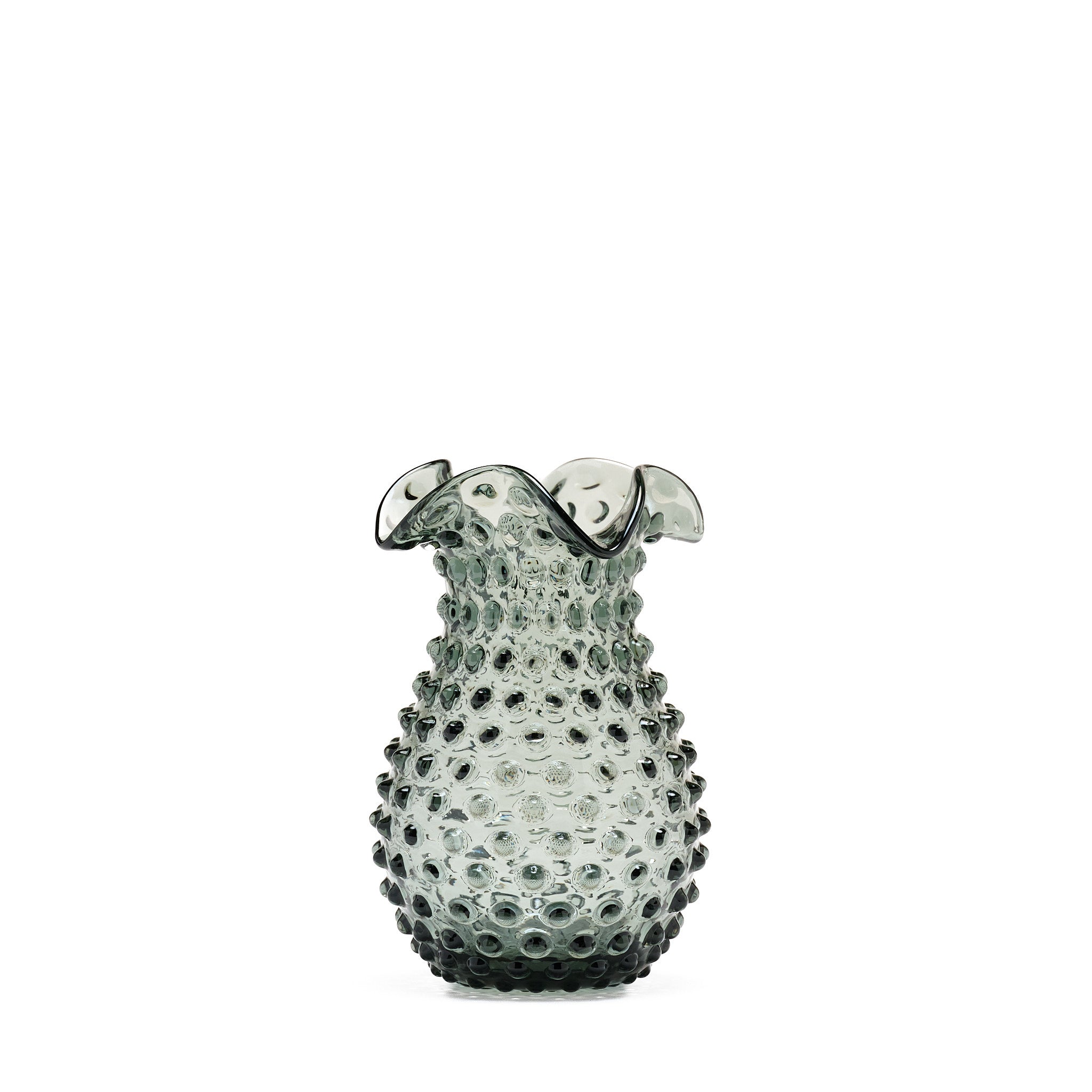 Decorative glass vase with textured design on a white background