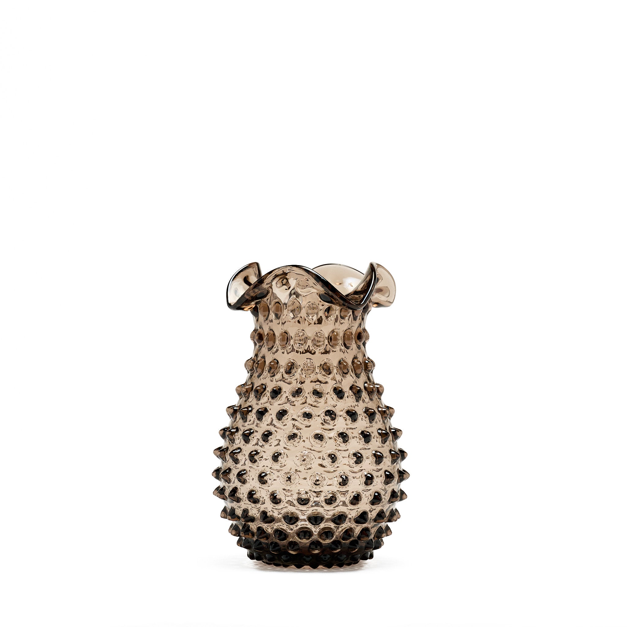 Decorative vase with textured surface on a white background