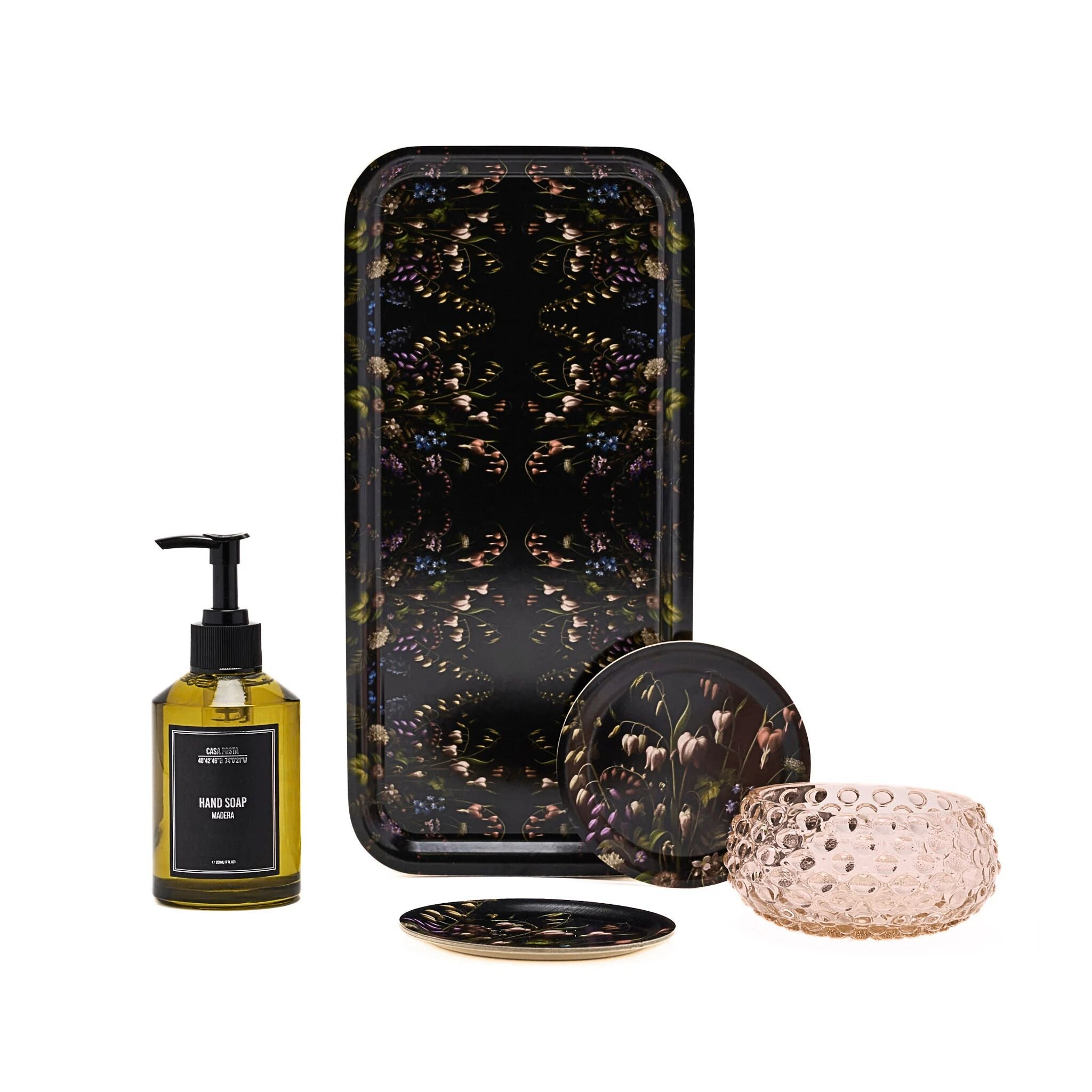 Set of decorative items including a phone case, soap bottle, coasters, and candle on a white background