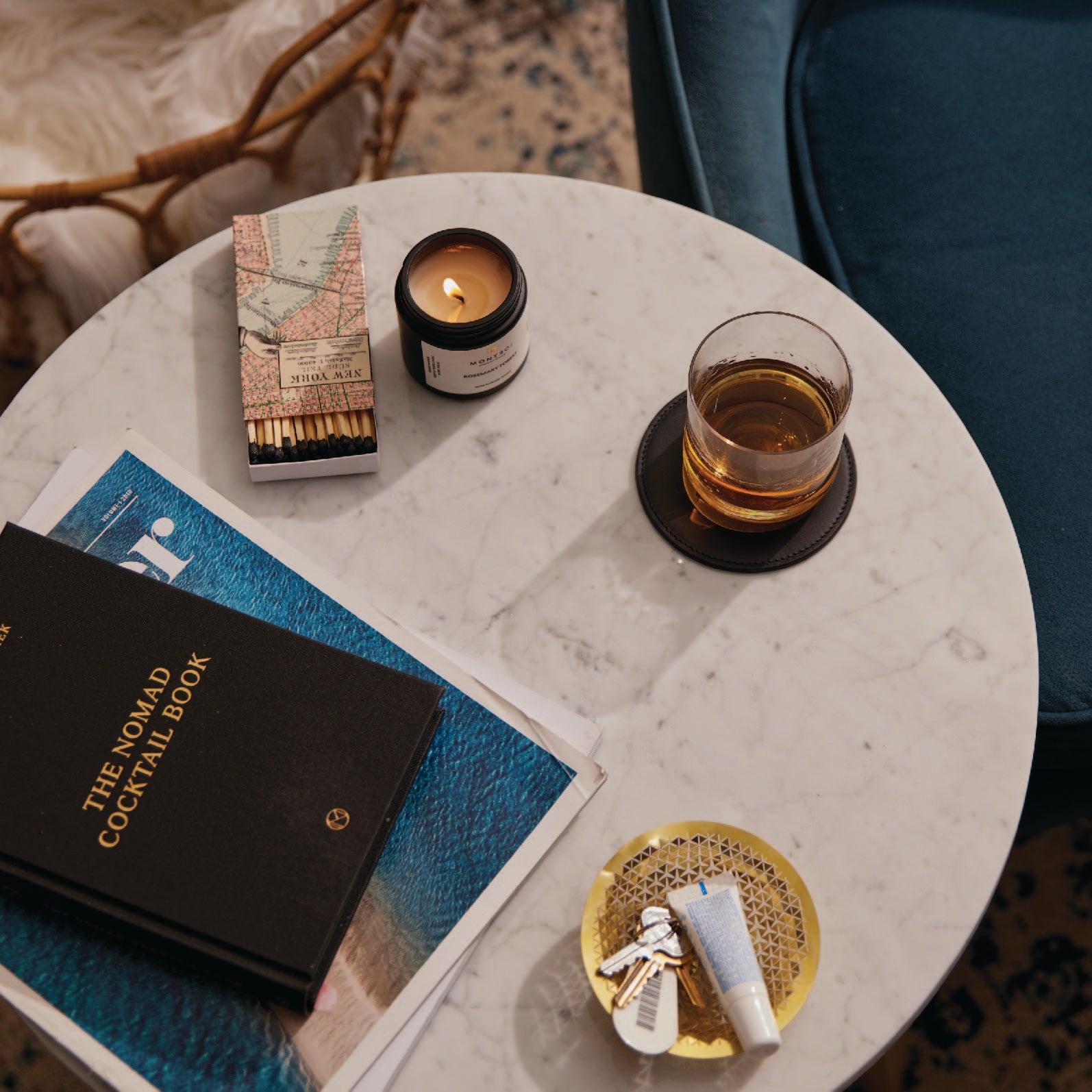 a table topped with a book and a candle