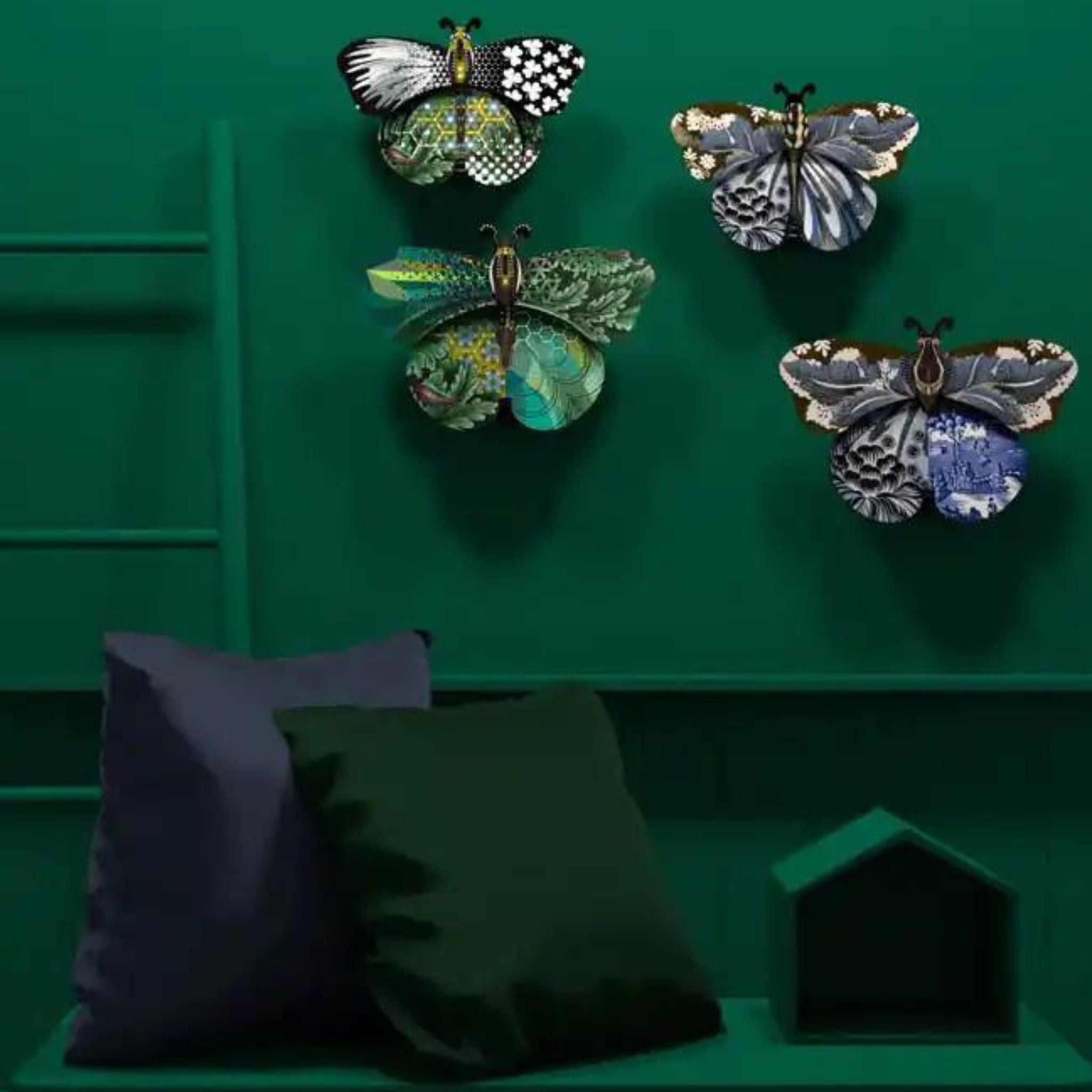 a green wall with a bunch of butterfly storage boxes on it