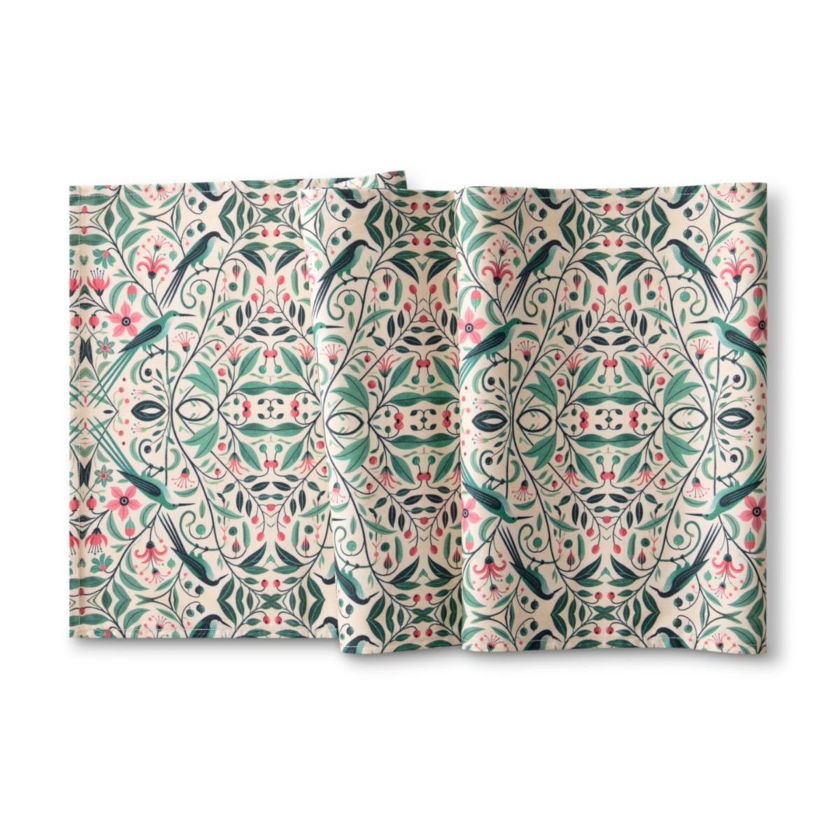 Two patterned pillows with a floral and bird design on a white background