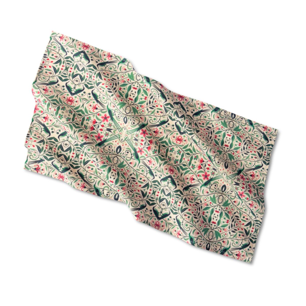 Floral and bird patterned fabric on a white background