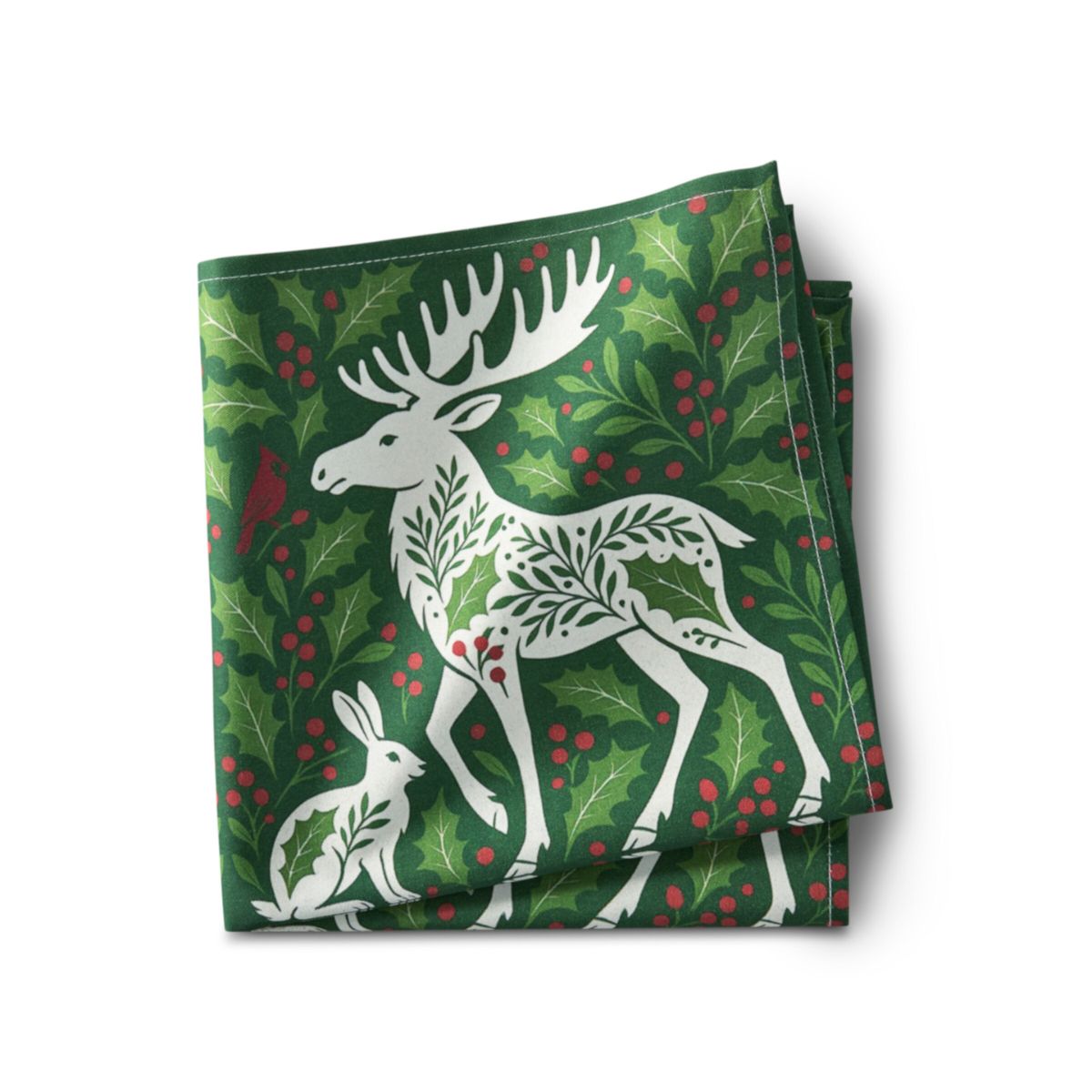 Folded green fabric with white deer and rabbit design on a white background