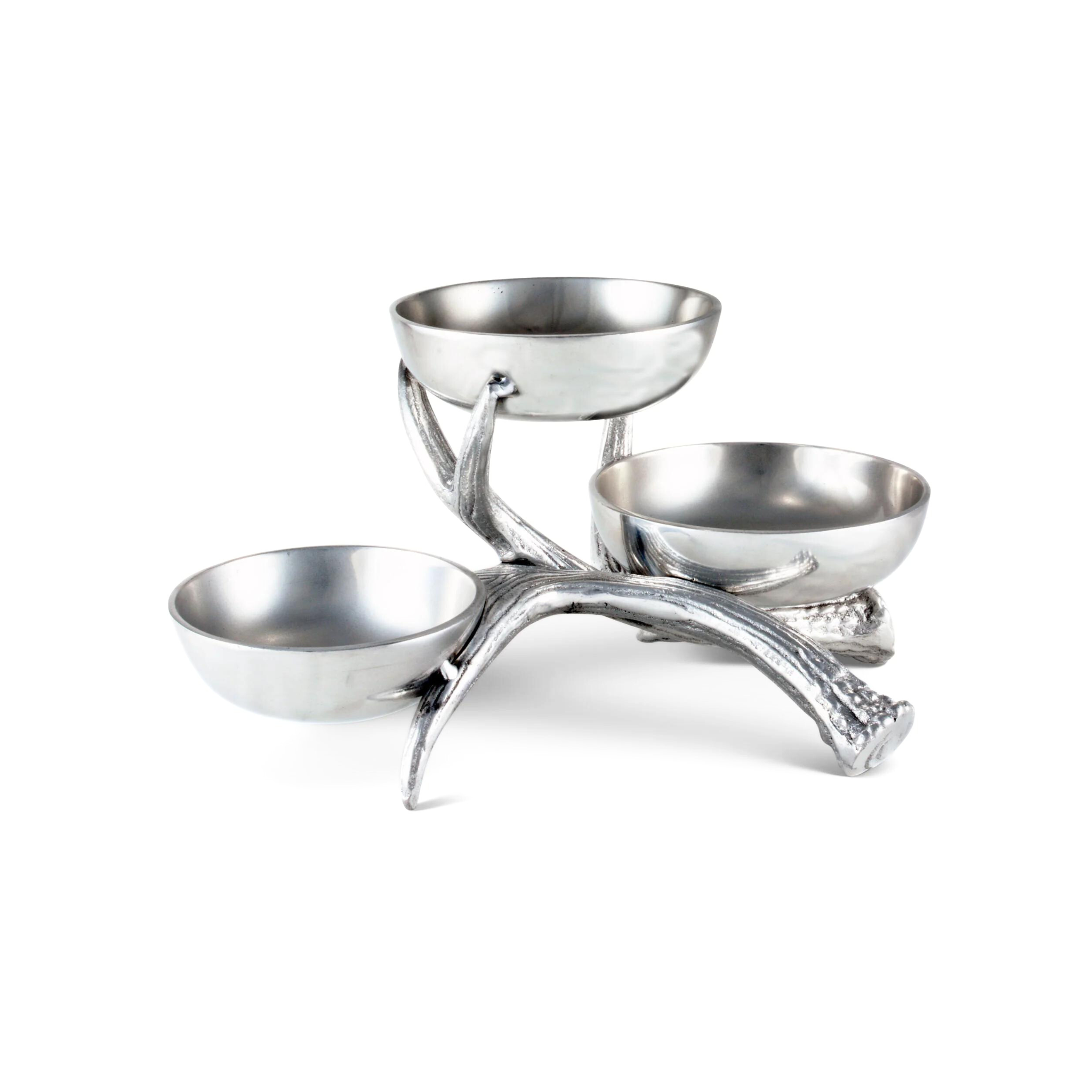 three metal serving bowls sitting on a metal antler