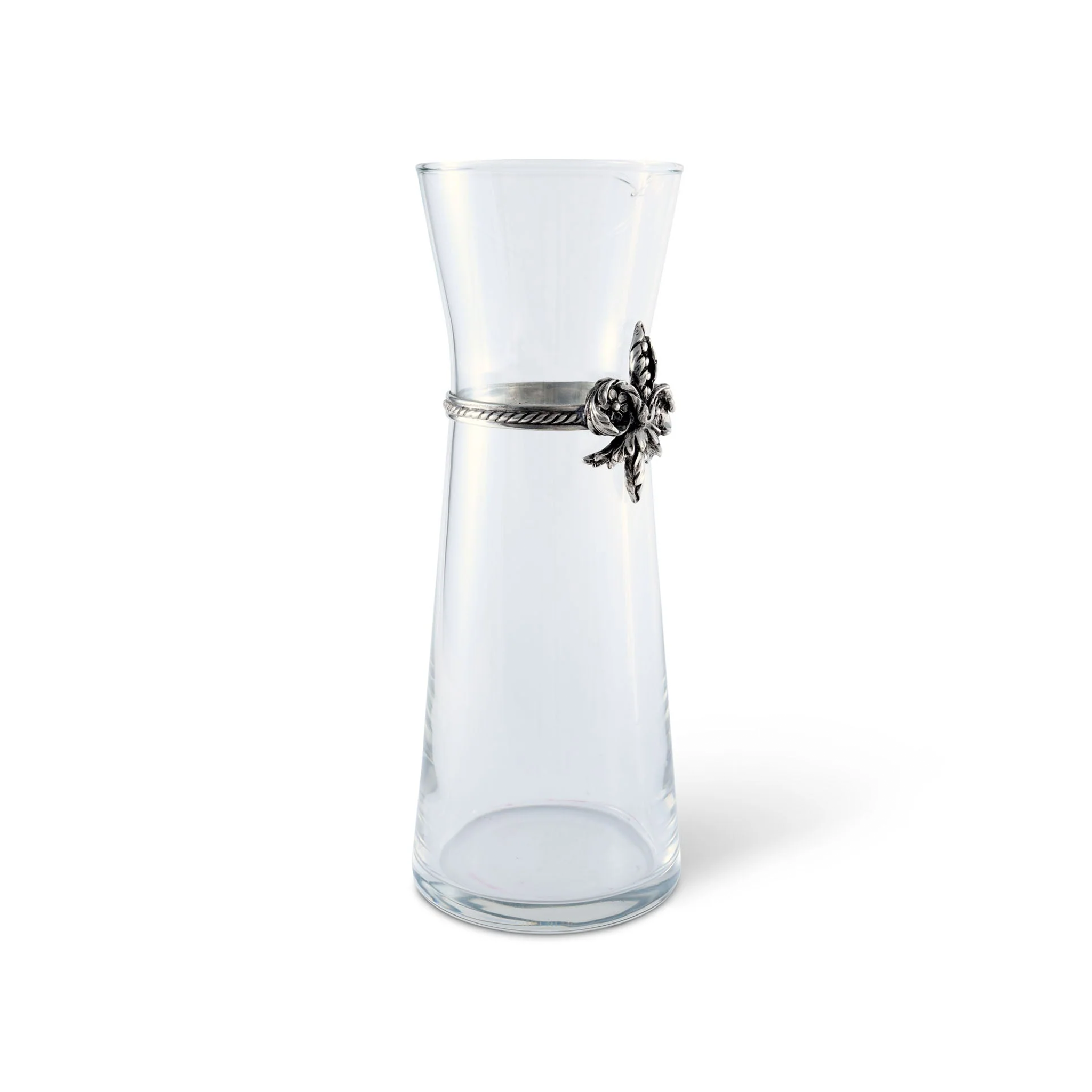 a clear wine carafe with a pewter metal fluer de lis on it