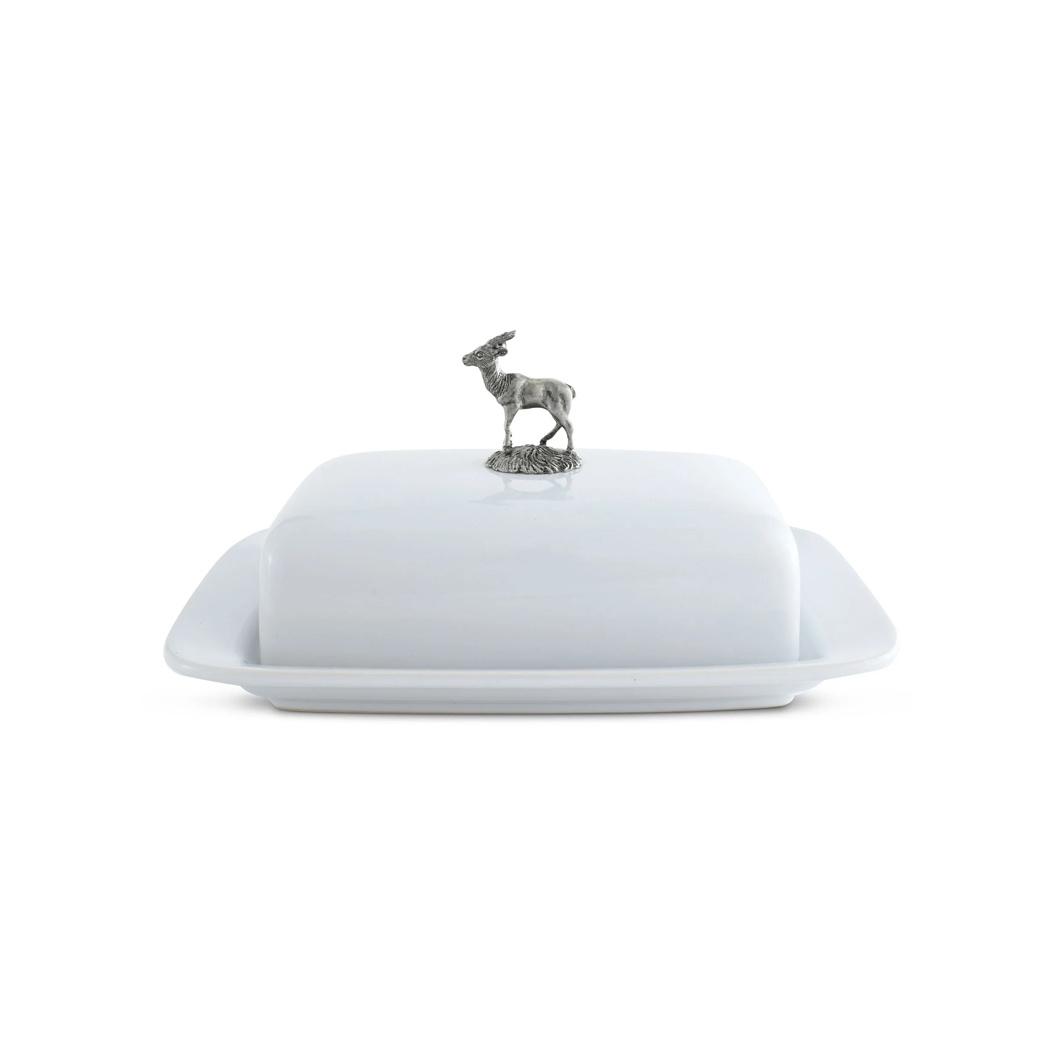 a white platter with a deer figurine on top of it