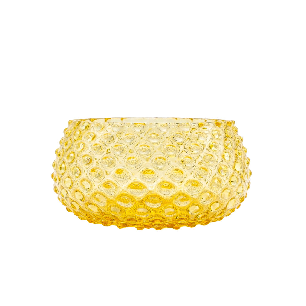 Yellow textured glass bowl on a white background
