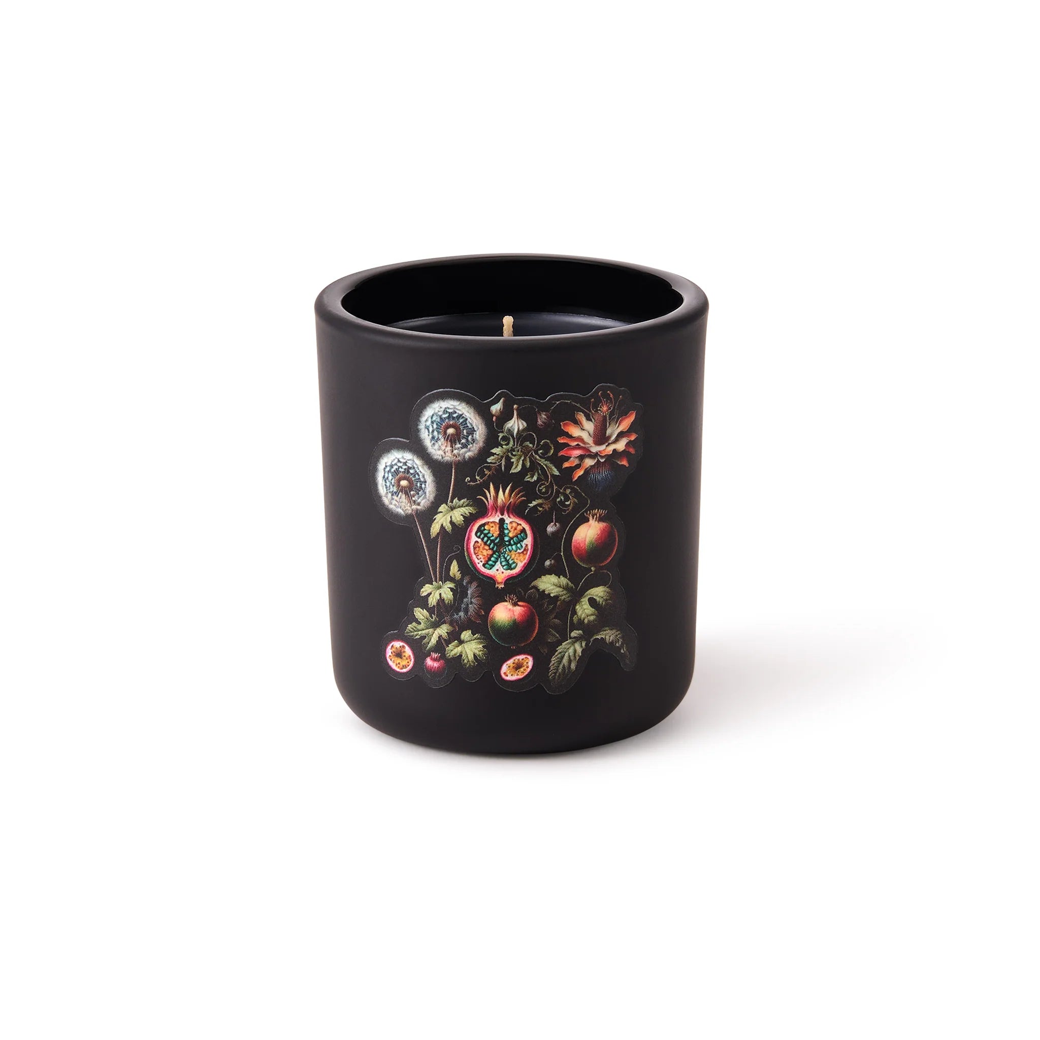 Black candle with botanical design on a white background