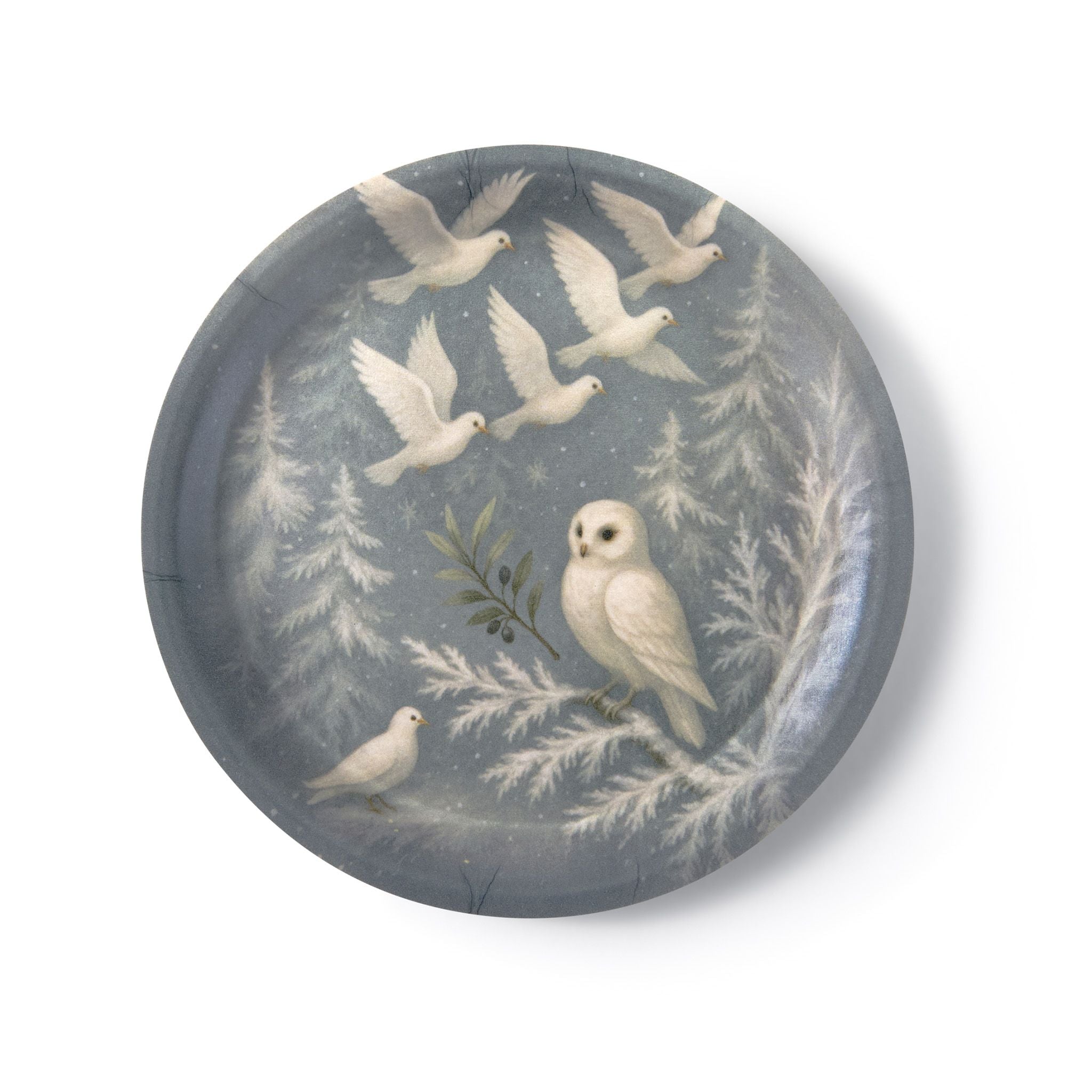 Decorative plate with white owl design on a blue background