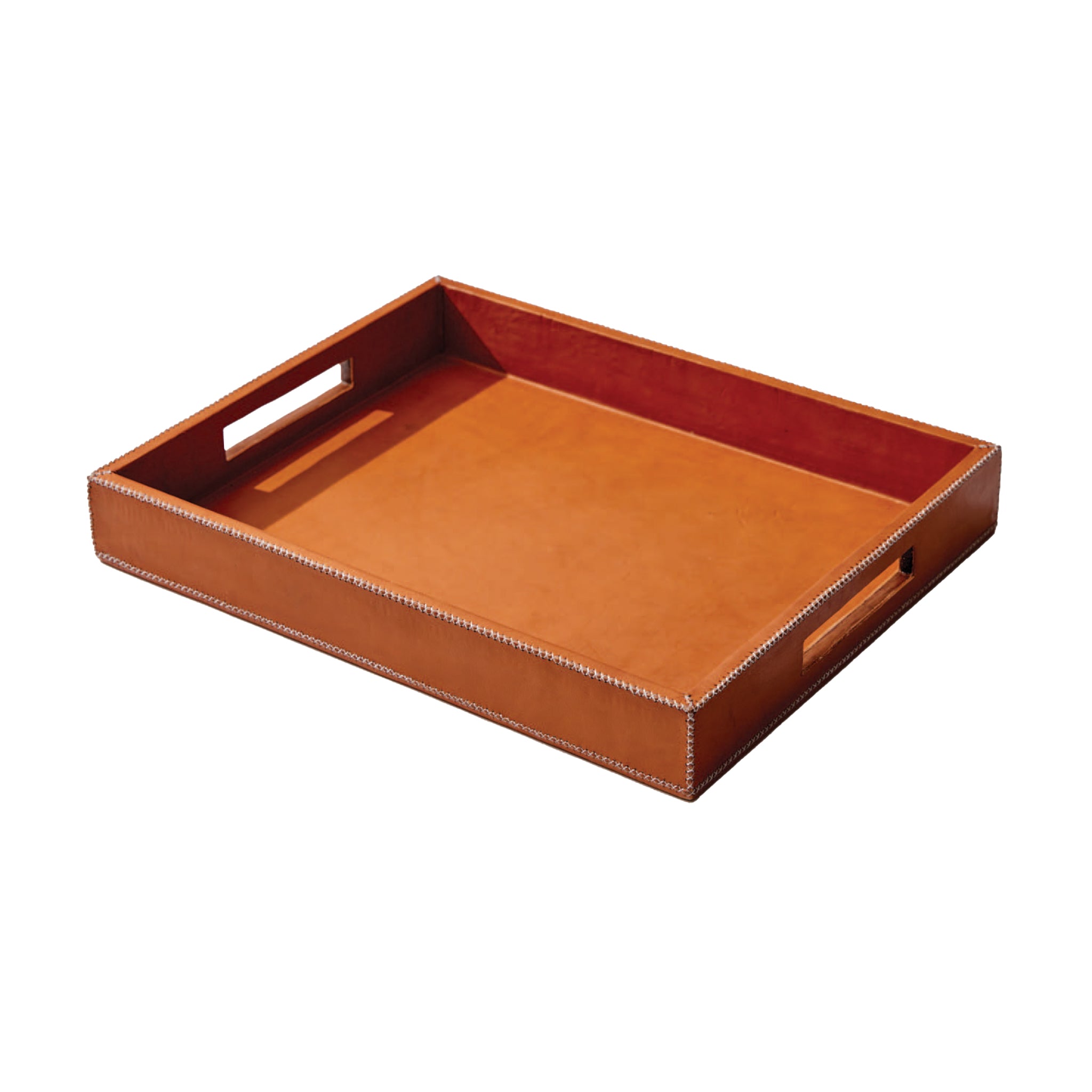 A large tan leather tray with handles on a white background