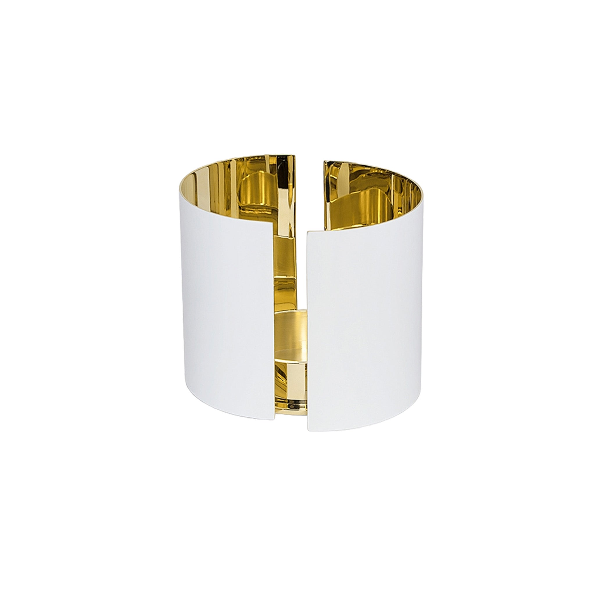 a white and brass candle holder by skultuna on a white background