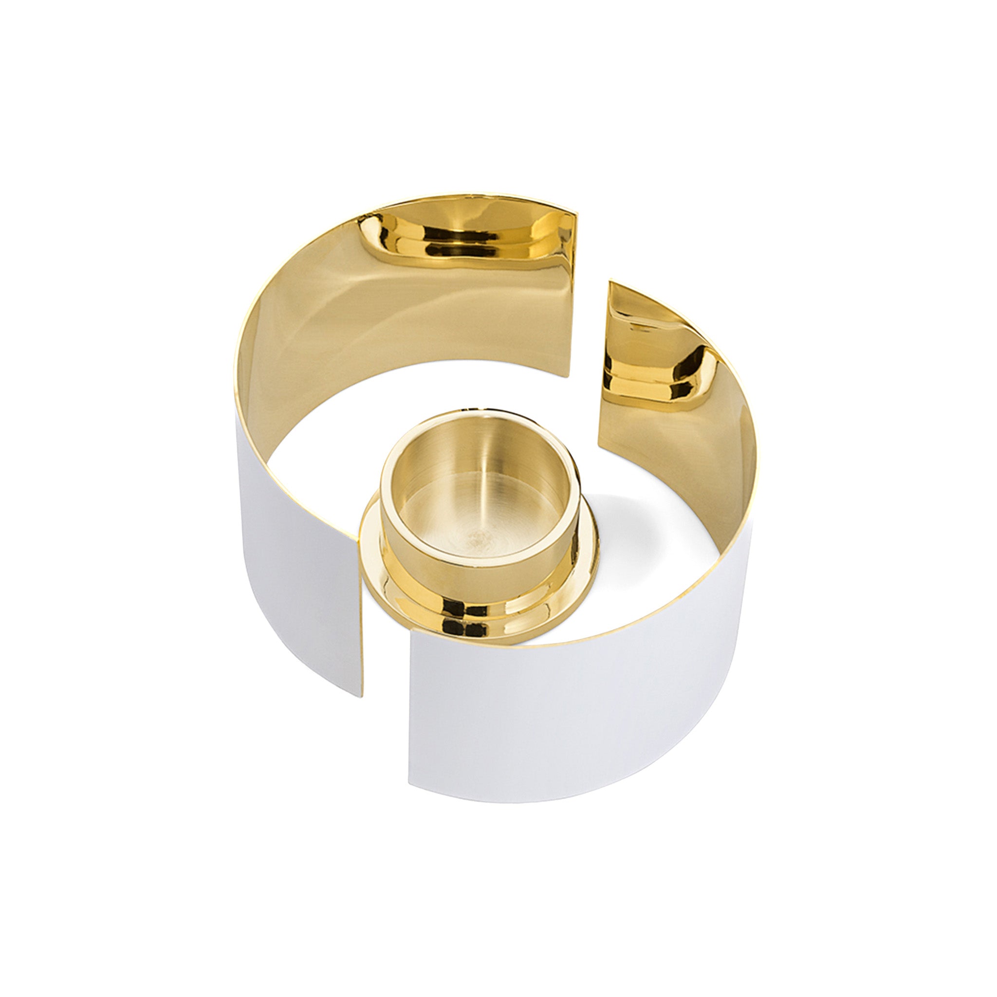 a top view of a white and brass infinity candle holder by skultuna on a white background