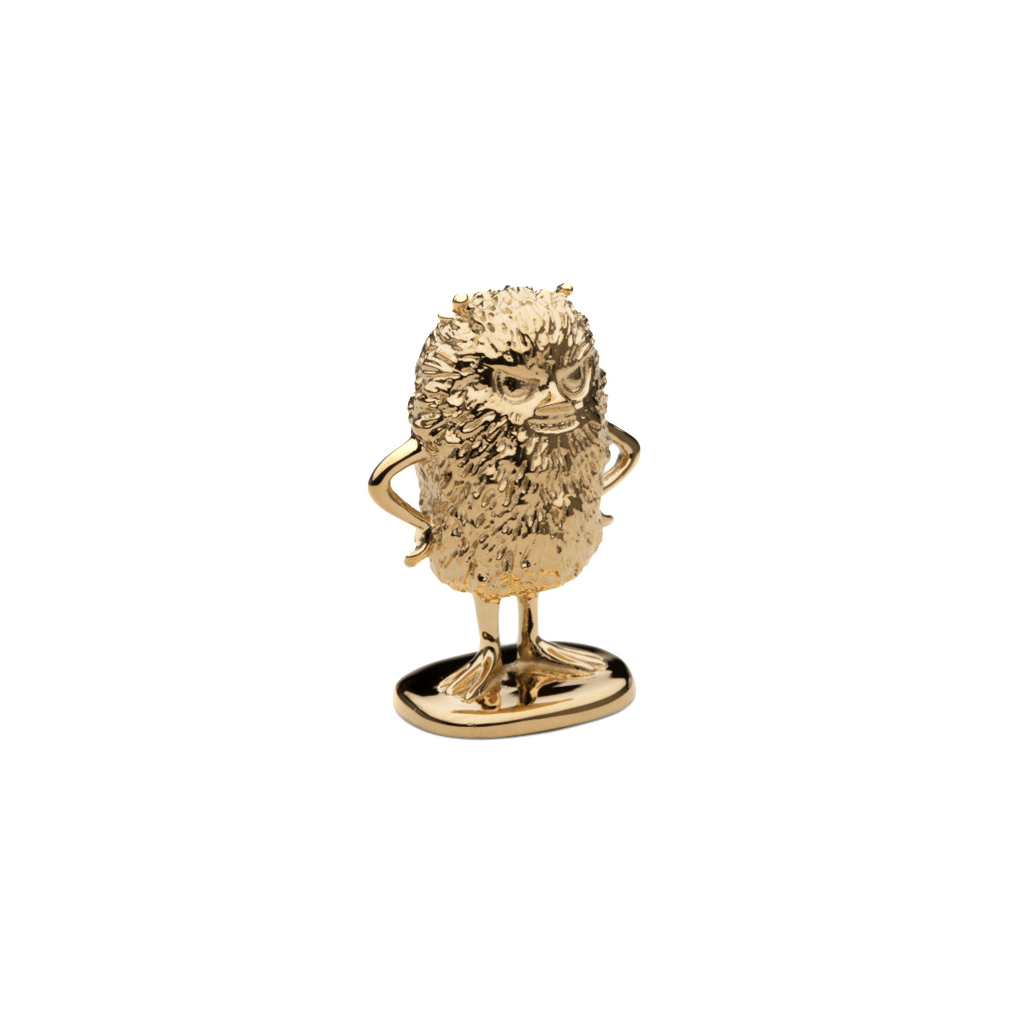 a gold figurine of moomin stinky facing at an angle on a white background
