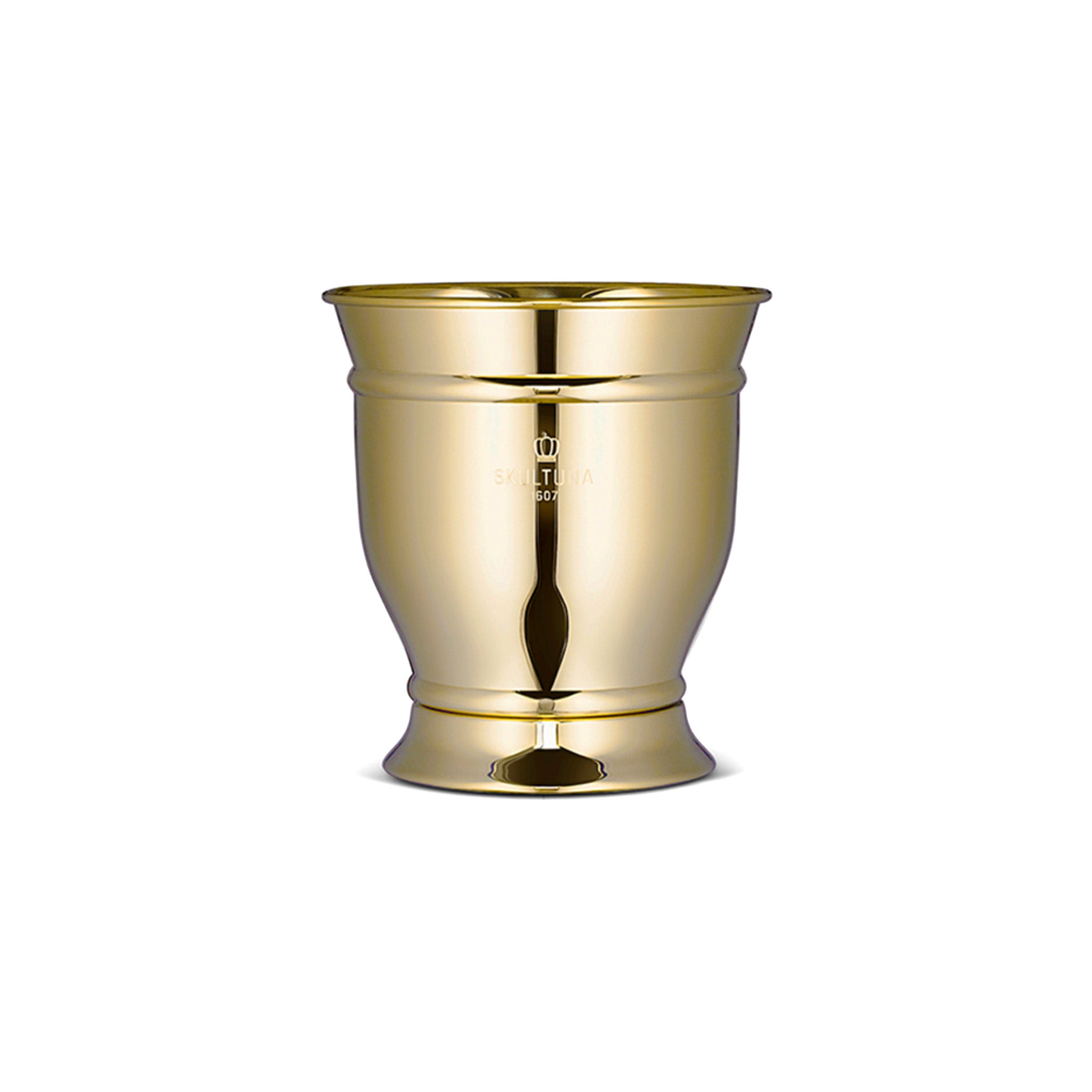 a brass champagne and wine cooler sitting on top of a white surface