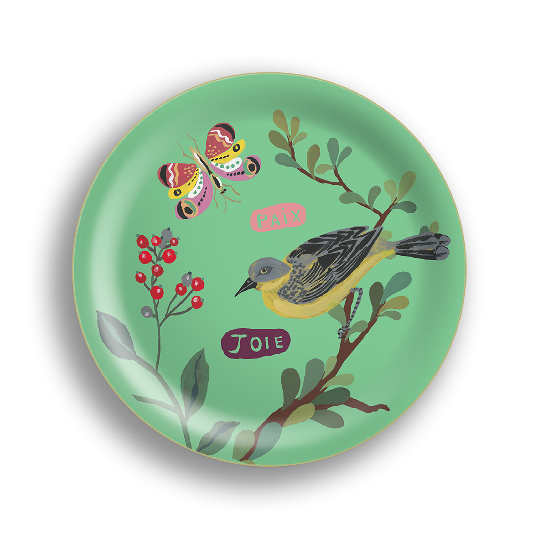 a circular green tray with a stylized yellow and black bird on a branch, red berries, and leaves. Two French words, "PAIX" (peace) and "Joie" (joy), are written in pink and purple, respectively. A colorful butterfly is also present, complementing the tray's design