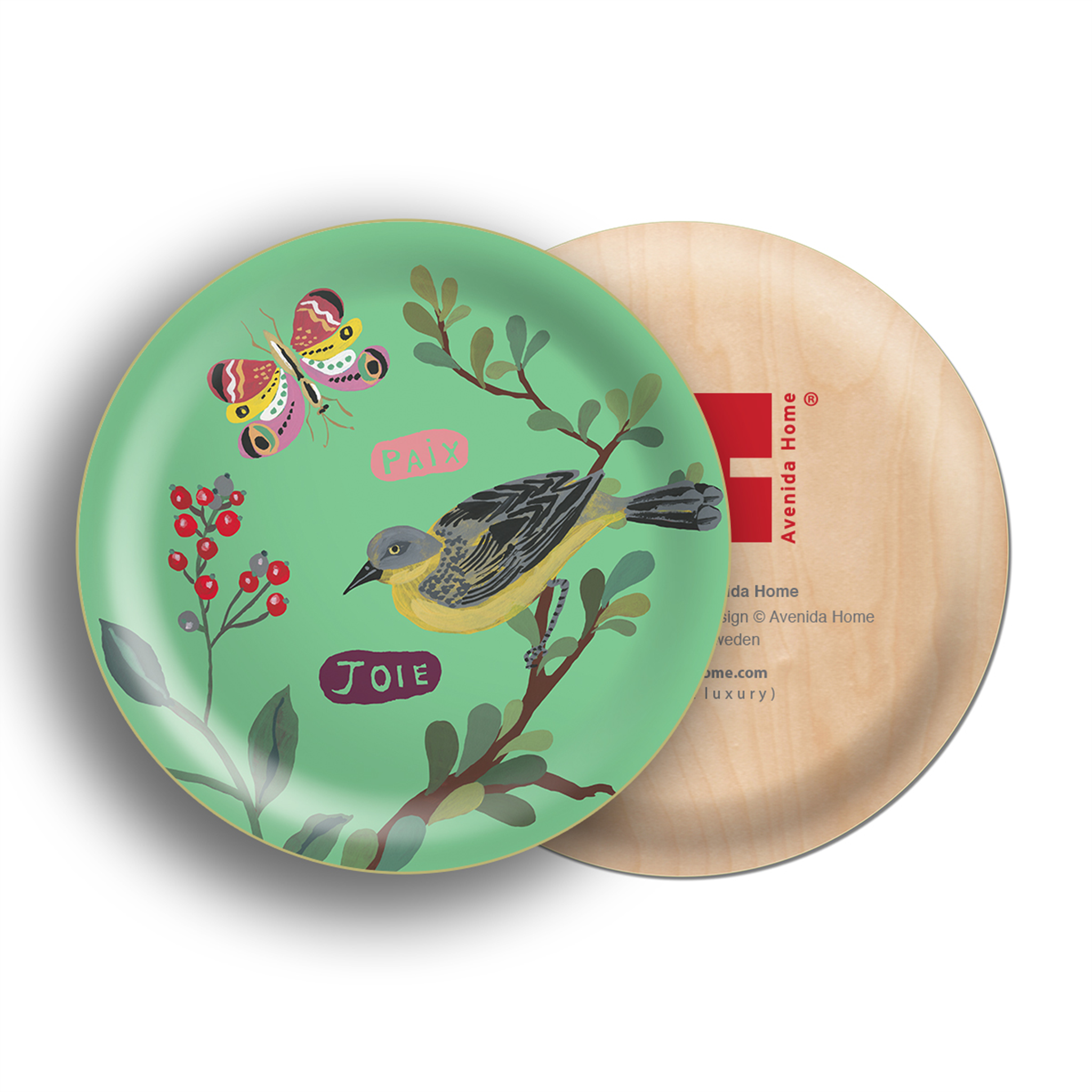a circular green tray with a stylized yellow and black bird on a branch, red berries, and leaves. Two French words, "PAIX" (peace) and "Joie" (joy), are written in pink and purple, respectively. A colorful butterfly is also present, complementing the tray's design.
