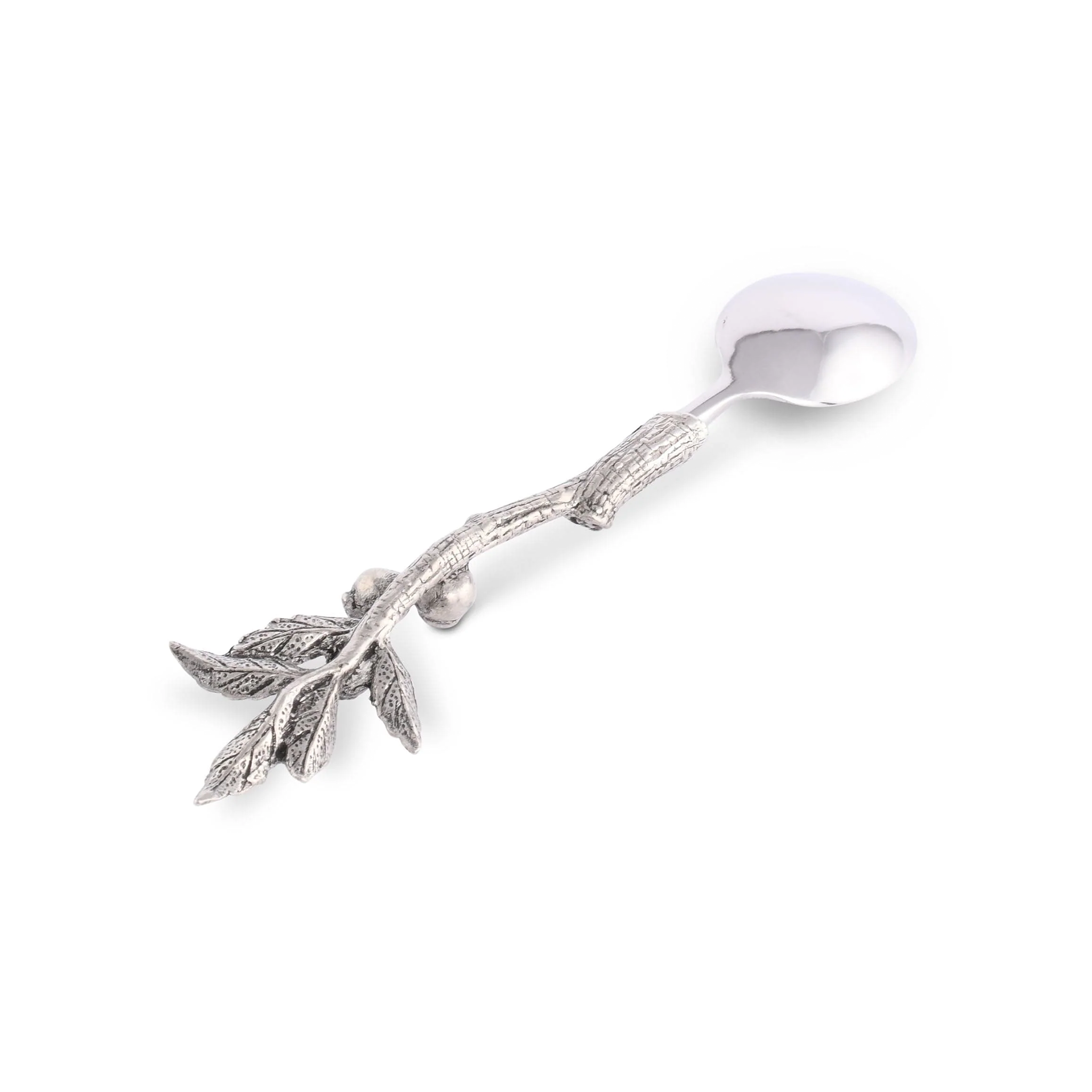 a spoon with a leaf design on it