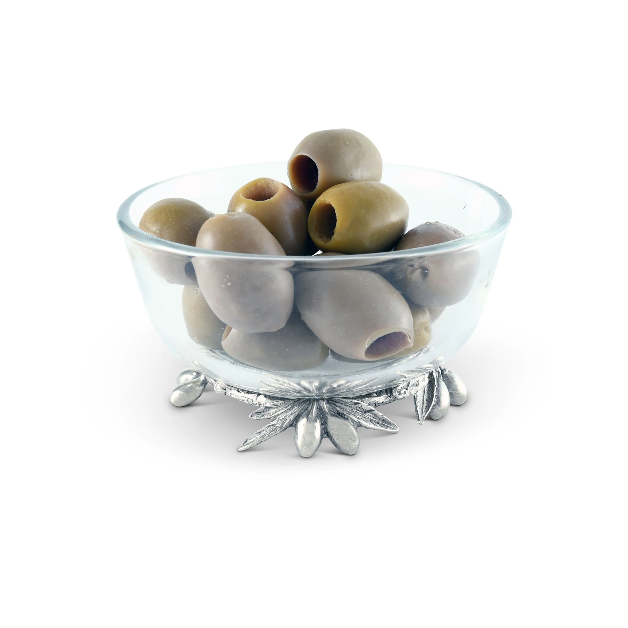 a glass bowl with pewter olives and leaves on it filled with olives