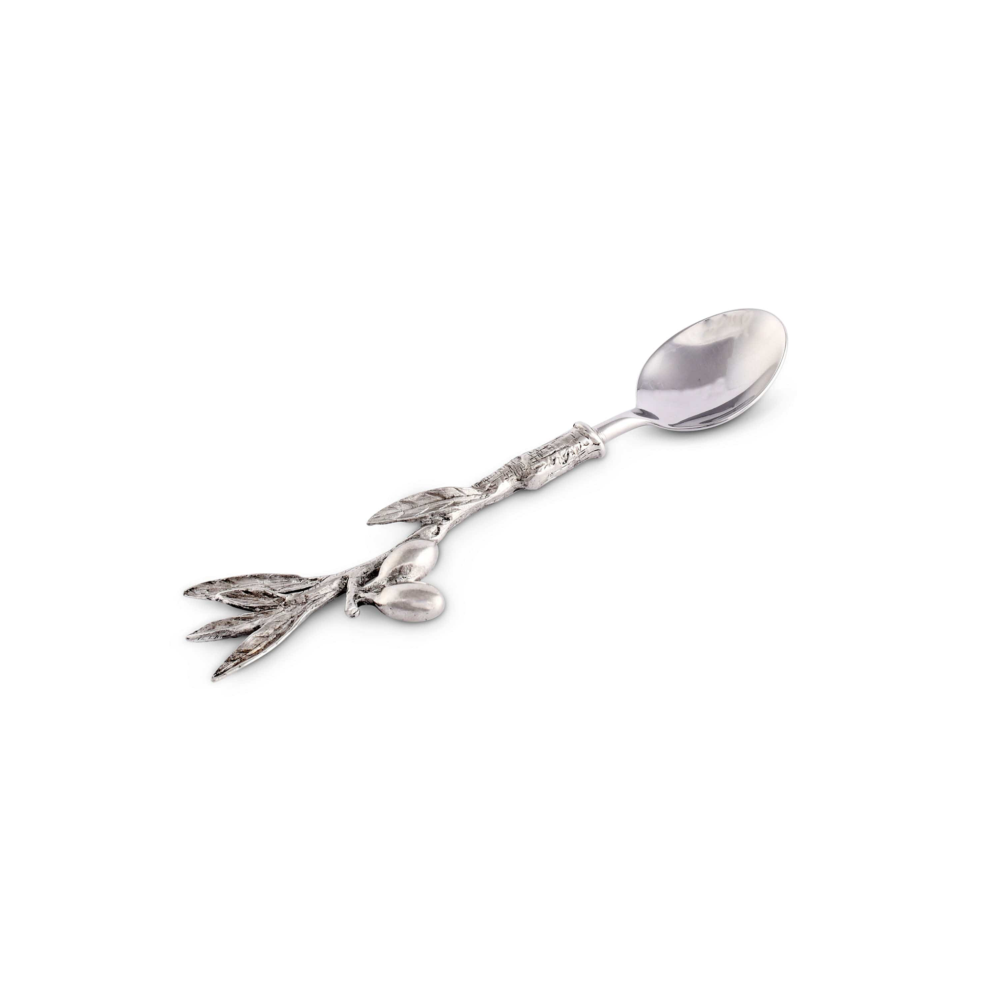 a spoon with a olive branch design on it